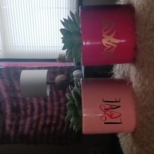 Faux succulents in red, pink ceramic plant holders. like new